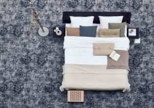 Groot vloerkleed Vintage Shades onder een tweepersoons boxspring.